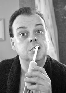 man brushing his teeth