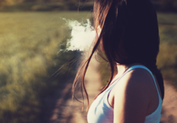 a woman smoking outdoors